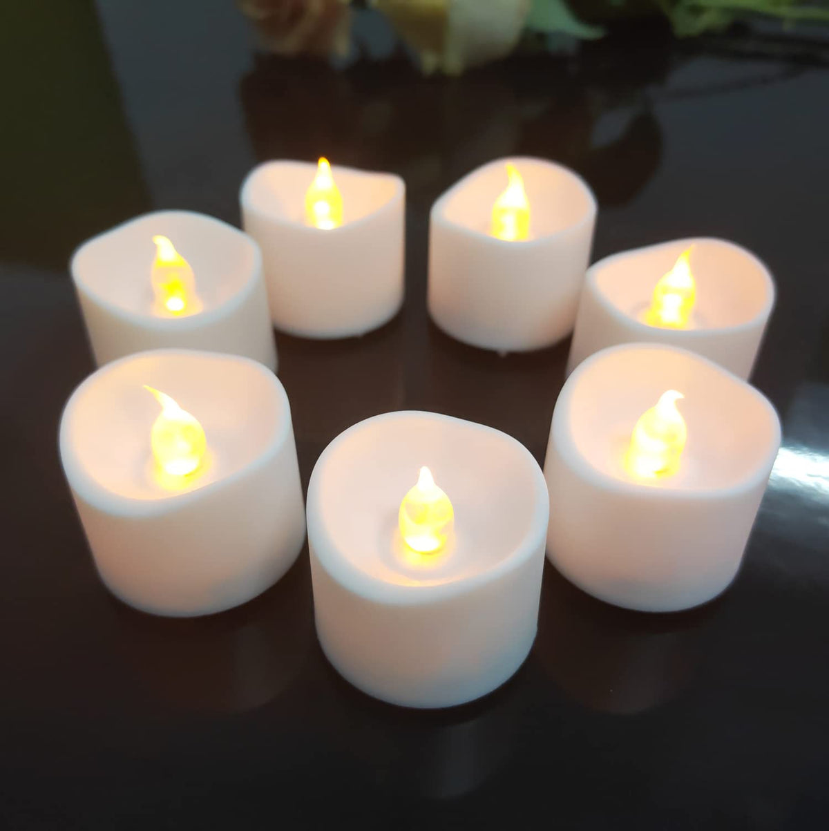 Jialine12 Pack Realistic and Bright Flickering Battery Operated Flameless LED Tea Lights Candles, 200+ tealights Electric Fake Candles for Halloween Weddings Festivals Decoration in Warm Yellow