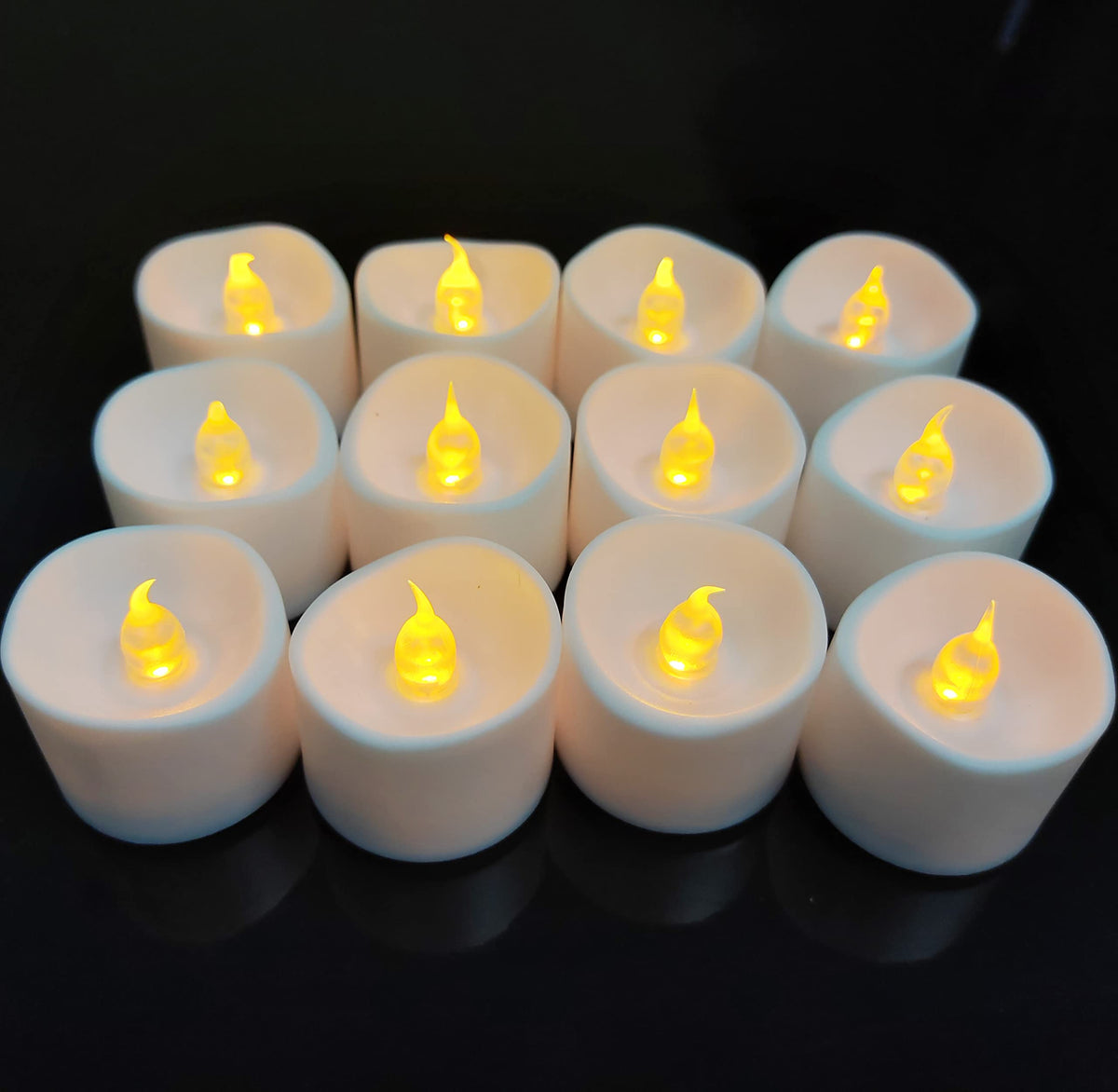Jialine12 Pack Realistic and Bright Flickering Battery Operated Flameless LED Tea Lights Candles, 200+ tealights Electric Fake Candles for Halloween Weddings Festivals Decoration in Warm Yellow